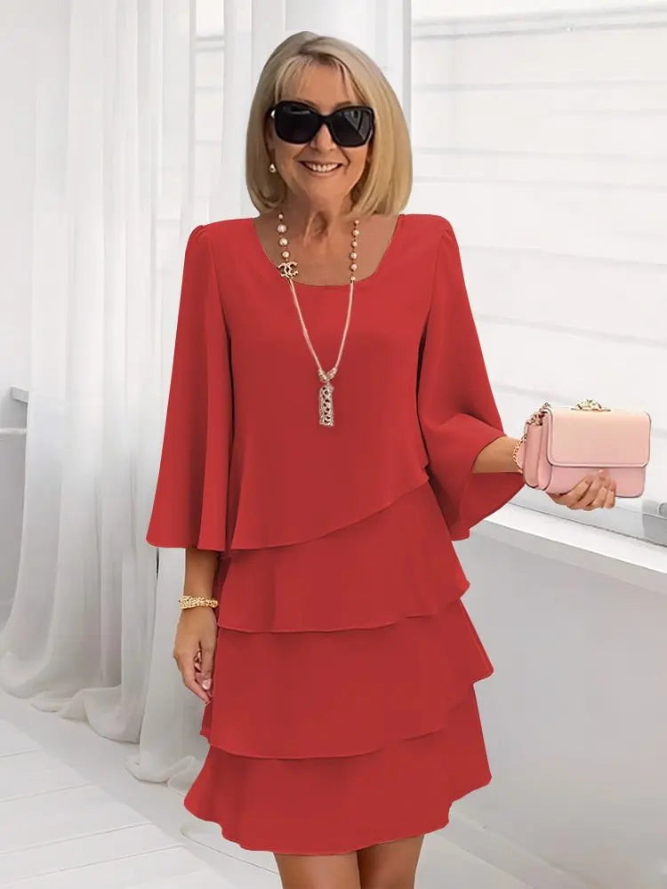 Carmen – Elegante vestido fluido con volantes